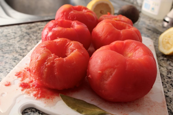 Tomatoes steamed from their skins and ready to be made into gazpacho