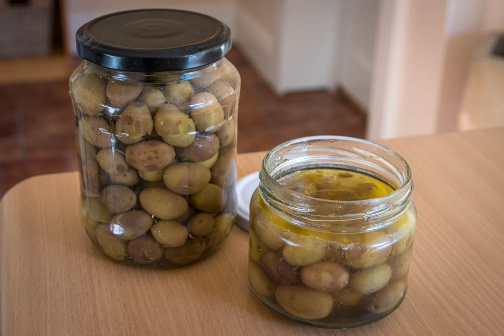 Cured olives inside two jars, ready to eat or give away.
