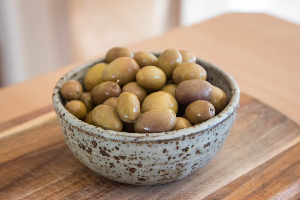 Preserved olives in a little clay bowl, ready for eating