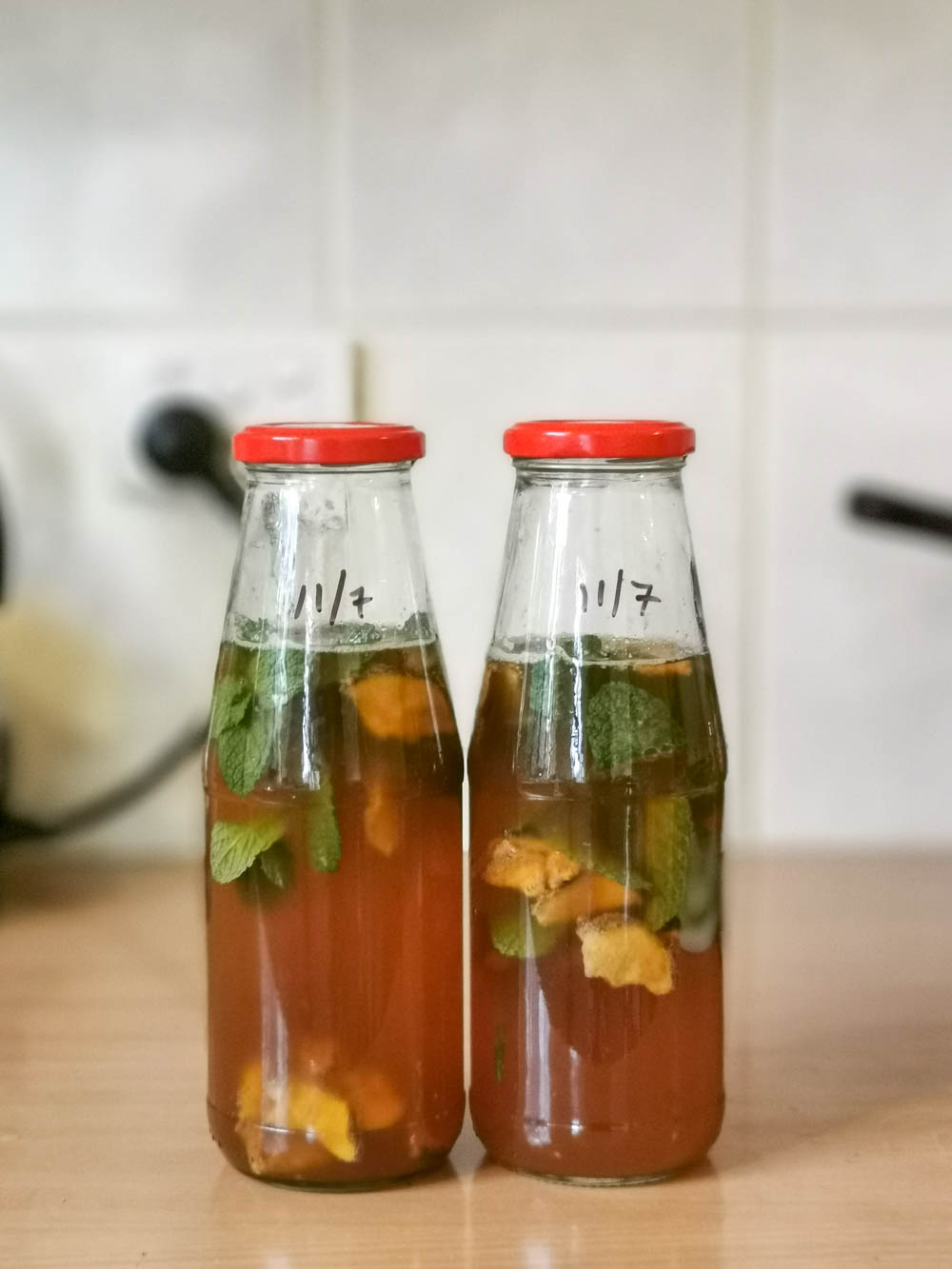 Mint and galangal kombucha brewing.