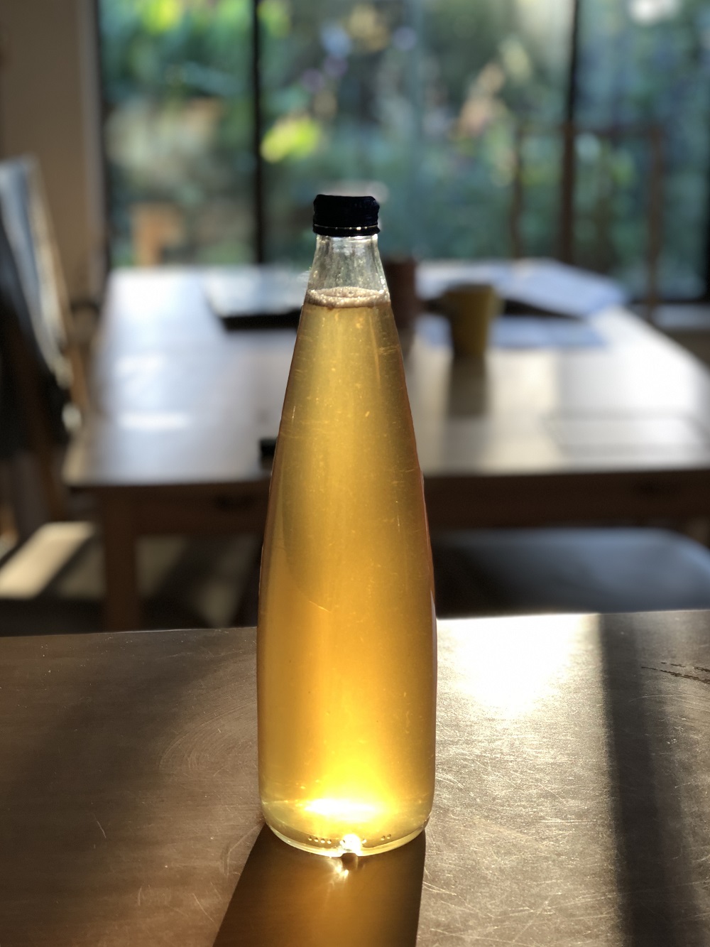 A finished bottle of solar-infused calendula oil.