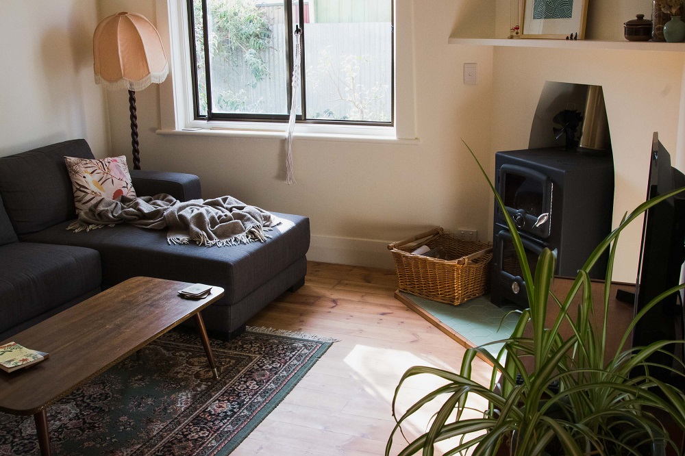 My sustainably renovated loungeroom - with a fireplace that doubles as an oven, and entirely secondhand furniture