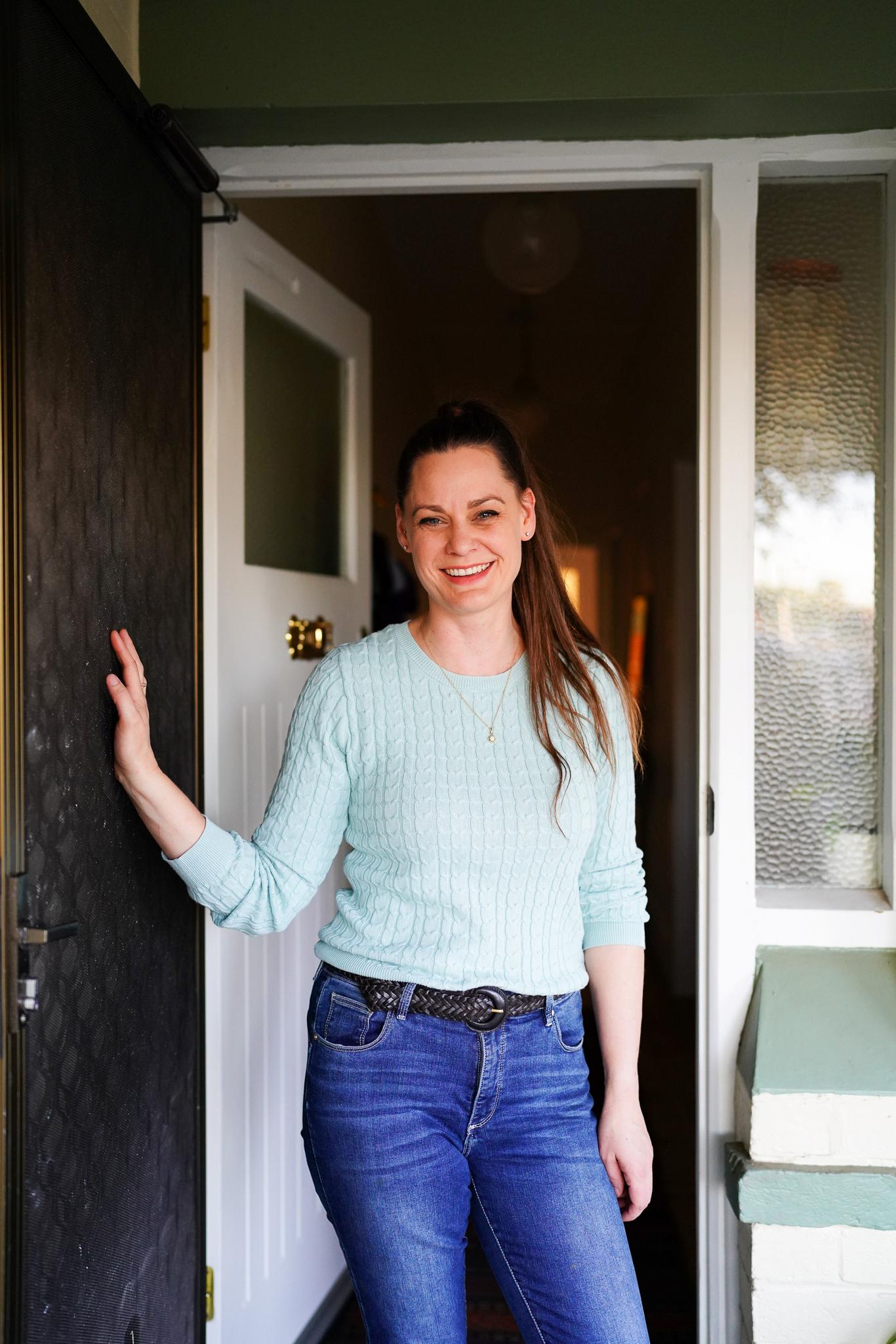 Koren Helbig standing at her front door